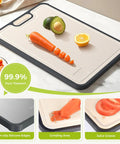 Two In One Titanium Cutting Board showing PP surface with carrot, avocado, and orange on large 15 by 10.3 inch board