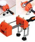 Durable Home Vise Table Work Bench Clamp With Stainless Steel Body And Non Slip Abs Jaws For Easy Woodworking Clamping Projects Plus Quick Clip Installation, orange clamp tightened on wood.