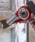 Master-Mite Series Heat Shrink System 220V Red 300 To 500 F Range 1440W Hot Air Tool being used for paint removal