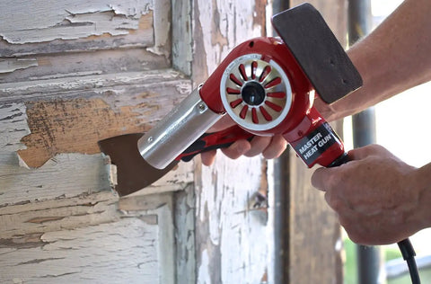 Master-Mite Series Heat Shrink System 220V Red 300 To 500 F Range 1440W Hot Air Tool being used for paint removal