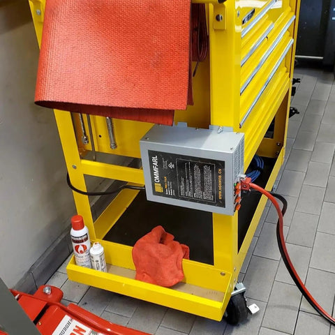 Heavy Duty 55 Amp Rv Converter Plug And Play Campground Ready Dc Power Supply, installed on a yellow workstation.