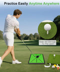 Man using Ultimate Golf Practice Mat Set With Replaceable Mats And Tees, Two Mat System For Driving And Chipping, Anti Slip Black Frame