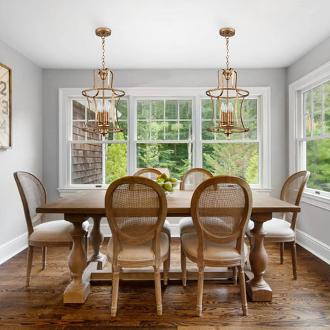 Modern Lantern Pendant Light With Four Lights In A Rusty Gold Finish hanging over dining table