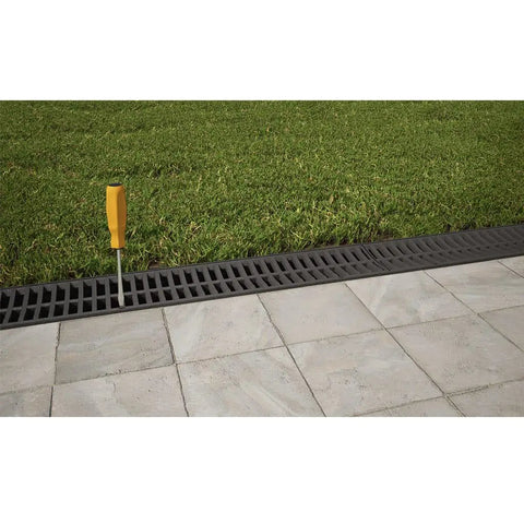 Pro Grade Trench Drain Kit With Black Grate, 9.84 Ft Total Length in lawn and pavement landscape installation view