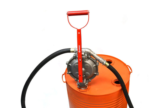This Heavy Duty Double Diaphragm Hand Fuel Transfer Pump Delivers Quick Eight Hundred Ml Strokes And Includes An Eight Foot Anti Static Hose on an orange drum.