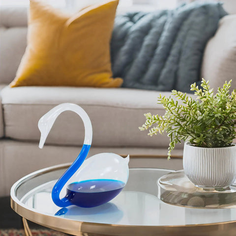 Elegant Swan Shaped Weather Predictor Barometer Weather Station 7 Inch Crystal Storm Glass on a table in a cozy room