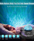 Person sleeping with Galaxy Star Projector Light, emitting blue lights and white noise; image shows Bluetooth speaker and controls