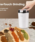 Mini Coffee Grinder 200W 28000RPM Stainless Steel Electric Powder Grinder with spices, coffee beans, and hand on button
