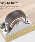 Slick Low Profile 1 Inch Fixed Caster Wheels Non Marking Rubber Sliders With Heavy Duty Steel Plates For Hassle Free Furniture Sliding Smooth Glide Zero Drama Setup Eight Pack mounted on wood with stainless steel screws.