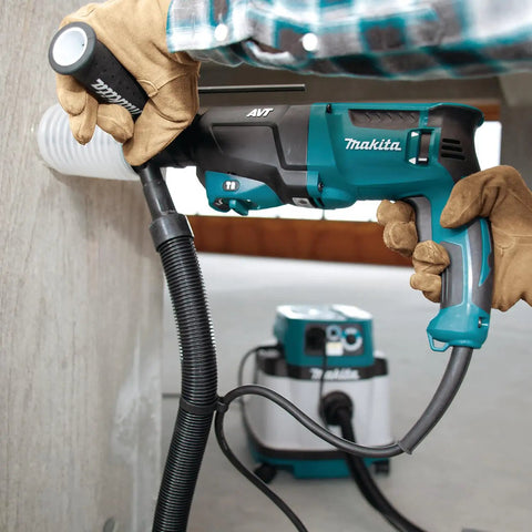 Person using Beast Mode 8 Amp SDS Plus AVT Rotary Hammer with D Handle 1 Inch Chuck on concrete wall, tool with less vibration.