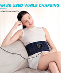 Woman using Cordless Back Relief Heating Pad With Built In Massager And Wearable Lumbar Support, plugged in and charging