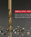 Cobalt drill bit close-up, gold-colored with spiral flutes and metal shavings.