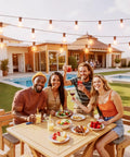 Group enjoying outdoor dinner under Outdoor String Lights 150 Ft With 75 Shatterproof G40 LED Bulbs 3 Spare Dimmable Warm White 2700K Waterproof