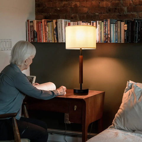 Tall Table Lamps Set Of 2, 27 Inch Touch Control Nightstand Lamps with USB ports on wooden side table near bed, bookshelf in background.