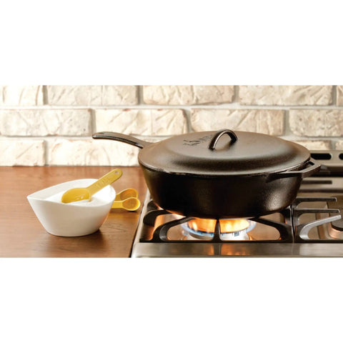 Heavy-Duty Cast Iron Covered Deep Skillet With Lid, 5 Quart on stove, pre-seasoned cooking, next to seasoning bowl
