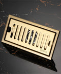 High Performance Stainless Steel Linear Shower Drain With Slick Brick Pattern Grate And Integrated Hair Catcher For Straight Shooter Water Flow and Zero Stank Headaches In The Bathroom Or Basement, gold SUS304 drain.