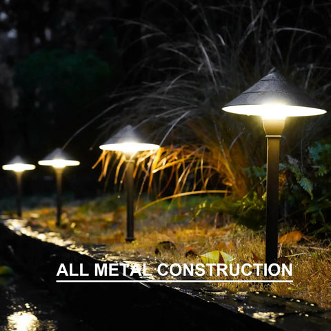 4 Pack Low Voltage Path Lights Kit With 2W LEDs 100 Lumen Warm White 2700K Bronze Outdoor Walkway Lighting along a garden path