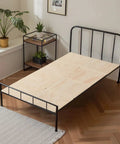 Twin Size Foldable Bunkie Board 35X71 Heavy Duty Wooden Bed Slat Foundation on metal frame in bright room.