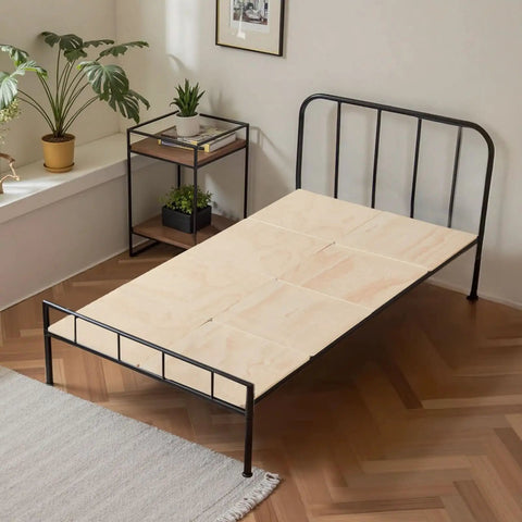 Twin Size Foldable Bunkie Board 35X71 Heavy Duty Wooden Bed Slat Foundation on metal frame in bright room.