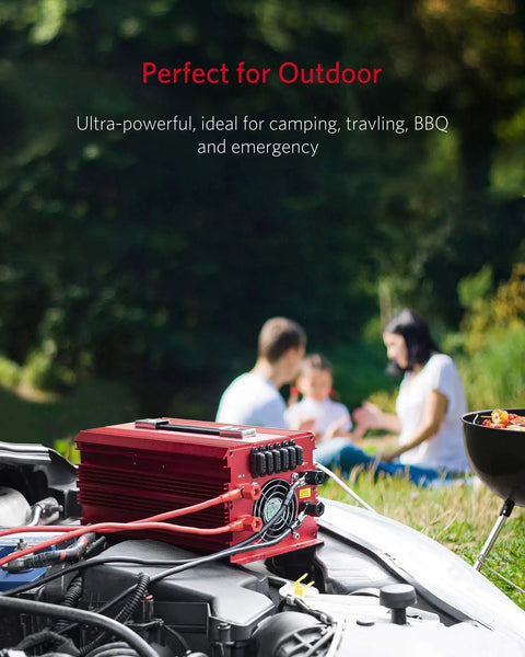 Heavy Duty 2000W Power Inverter DC To AC Converter With 3 AC Outlets Car Battery Charger displayed outdoors during camping.