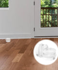 Two Pack Silicone Door Stopper Wedges To Prevent Finger Injuries And Door Slams placed on hardwood floor near door