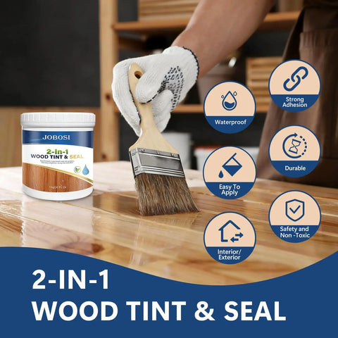 Close-up of a hand applying Dark Walnut Wood Stain And Sealer 32 Oz Quart on wood surface with a brush.