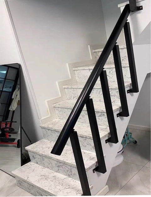 Heavy Duty Black Iron Balusters 8 Pack Rust Resistant Railing Spindles With Secure Flat Brackets Hella Tough Deck Stair Guardrails, installed on marble stairs.