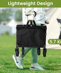 Person carrying folded Lightweight Foldable Wagon With 360 Degree Wheels And Flexible Handle, 220 Lb Load Capacity