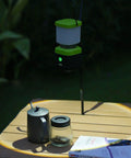 3 Pack 6500K White LED Camping Lanterns Rechargeable 1000 Lumen Each With 4500mAh Power Bank illuminating a table outdoors