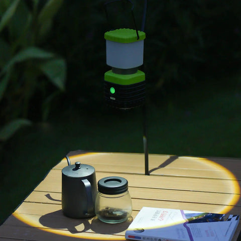 3 Pack 6500K White LED Camping Lanterns Rechargeable 1000 Lumen Each With 4500mAh Power Bank illuminating a table outdoors