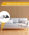 Image of a living room with a sofa featuring the 12 Pack 1.5 Inch Square Self Adhesive Furniture Sliders Pads for floors.