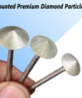 Close-up of Umbrella Shape Diamond Burr Set For Rotary Tools, 7 Pc 240 Grit With One Eighth Inch Shank held in hand