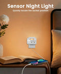 Plenty Of Power Now Super Slim 3 Plug Extender With Soft Led Guide Light 1875W Grounded Wall Splitter on bedside table with phone charger.