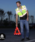 Man wearing High Visibility Reflective Safety Vest With Pockets And Zipper, ANSI Class 2 Mesh, 3M Reflective Tape, Yellow And Black, Large