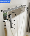 Beefed Up Bi Folding Sliding Barn Door Hardware Kit For Two Doors With 330 LB Capacity Black J Track Roller installation view
