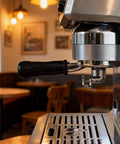 Professional Grade Three Ear Espresso Portafilter With Base And Double Spout Built From Premium Stainless Steel Compatible With Breville Makers viewed on espresso machine.