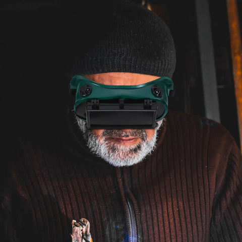 Industrial Grade Welding Goggles With Dual Flip Up Covers That Sit Hella Comfy Featuring An Adjustable Contour Strap Heavy Duty Impact Resistant Dust Proof Safety Specs Built Tough For Daily Grind worn by a man.
