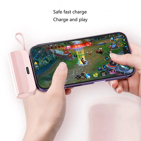 No Sweat Battery Charging Case For Rechargeable Cells Solderless DIY Power Bank Housing charging a smartphone while gaming.