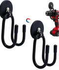 Magnetic Power Drill Tool Organizer Holder With Heavy Duty 2 Inch Opening Sweet For Garage Storage Magnetic Tool Holder Rack Rubber Covered Industrial Magnet Holds Up To 5 Pounds No Tools Needed Easy Mount showing two black hooks with magnetic base holding a red drill.