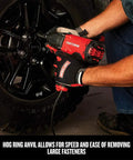 Mechanic using Half Inch Corded Impact Wrench, 7.5 Amp Power, 450 Ft Lbs Max Torque, on car wheel fasteners