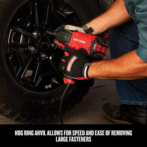 Mechanic using Half Inch Corded Impact Wrench, 7.5 Amp Power, 450 Ft Lbs Max Torque, on car wheel fasteners
