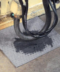 Premium Oil Absorbent Mat Pads 15 x 20 Inches under equipment, showing spill absorption, heavy duty 28 oz absorbency per pad, 100 count