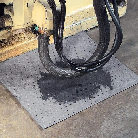 Premium Oil Absorbent Mat Pads 15 x 20 Inches under equipment, showing spill absorption, heavy duty 28 oz absorbency per pad, 100 count