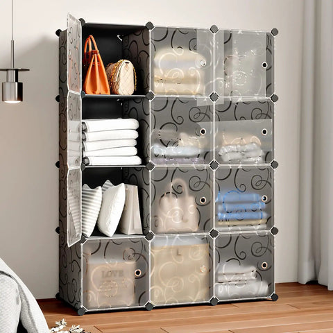 Multipurpose Portable Cube Storage Organizer 14 Inch By 14 Inch Black 4 By 3 Cube Cubbies For Clothes Toys And More Space Saving Closet And Toy Cabinet Durable Plastic Dresser Cubes filled with clothes and bags in a bedroom corner.