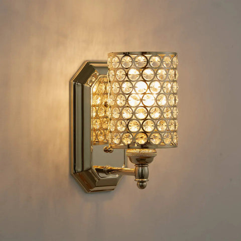 Two Pack Crystal Wall Sconce Lights With Champagne Finish Modern Minimalist Style Slick Polyhedral Crystal Shade For Bathroom Bedroom Living Room Bedside Fully Dimmable mounted on a wall, glowing.