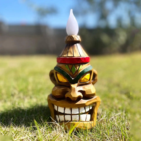Outdoor Solar Tiki Head Statue With Dancing Flame Glow for garden yard, resin 8.74 inch figurine on grass