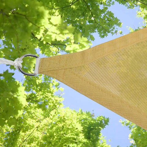 Corner of yellow Triangle Shade Sail Canopy 12x12x12 Ft Built Tough 200 GSM High Density Fabric For Patio Backyard Pool Outdoor Use with foliage