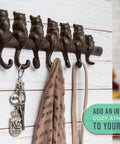 Hella Tough Cast Iron Wall Hook Rack With Seven Cute Cat Designs For Coats Keys And Hats, Vintage Rustic Brown decorative organizer with keys.