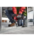 M12 Fuel Half Inch Hammer Drill Driver With Brushless Motor Ultra Lightweight used by worker on construction site