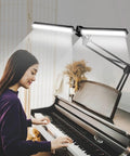 2 In 1 LED Desk Lamp With Clamp, 24W Ultra Bright Table Lamp illuminating a piano with a dual head design for home office setup